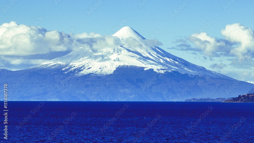 Osorno Volcano At Puerto Varas In Los Lagos Chile. Volcano Landscape. Sky Clouds Background. Los Lagos Chile. Snowcapped Mountain. Osorno Volcano At Puerto Varas In Los Lagos Chile. Osorno Volcano At Puerto Varas In Los Lagos Chile. Volcano Landscape. Sky Clouds Background. Los Lagos Chile. Snowcapped Mountain. Osorno Volcano At Puerto Varas In Los Lagos Chile.