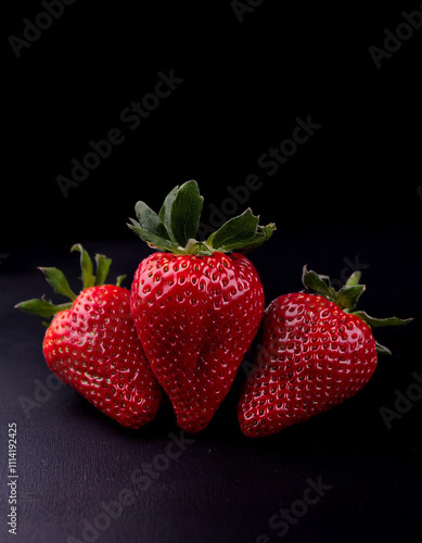 Wallpaper Mural Bright and Juicy Strawberries Displayed on a Dark Background for an Elegant Food Presentation Torontodigital.ca