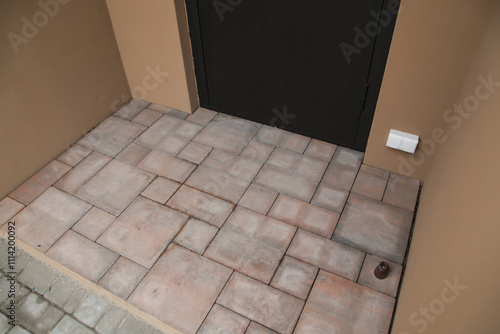 Paving Slabs. Empty Place for Door Mat Entryway Outdoor Mat Brown floor tiles. Top View photo