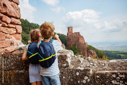 Kids spot distant castle Girsberg ready for exciting journey photo