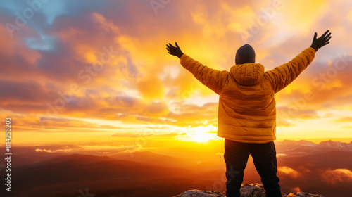 Person Embracing Sunset with Outstretched Arms in Majestic Mountain Landscape View