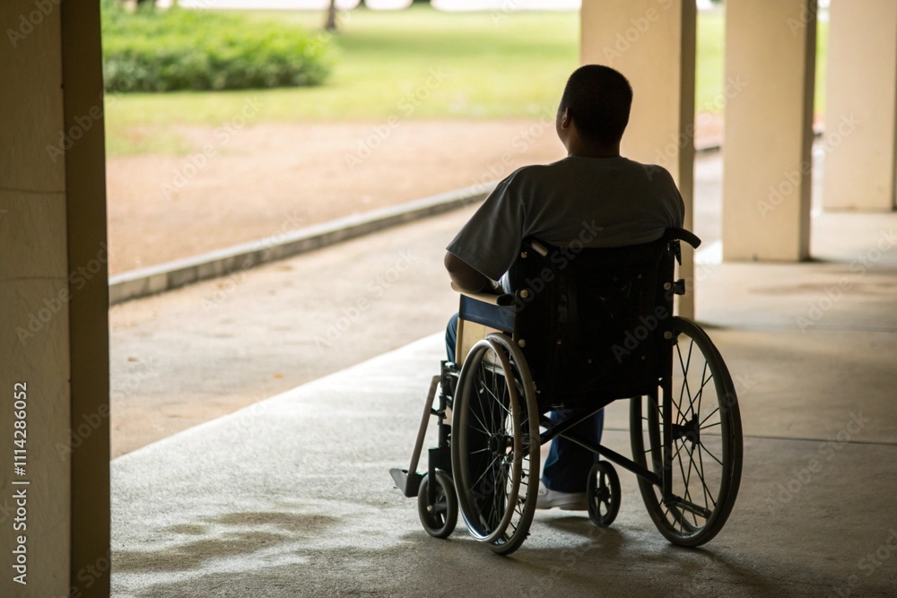 Man in a Wheelchair Observing a Vibrant Urban Setting from Behind Man in a Wheelchair Observing a Vibrant Urban Setting from Behind