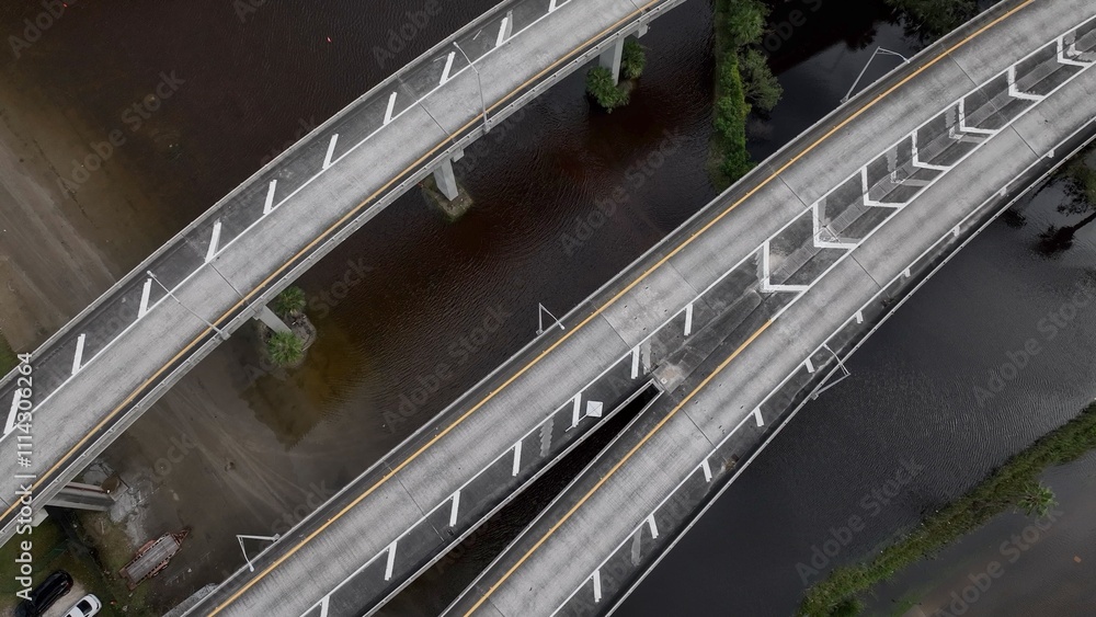 Obraz premium Flooded streets in big city after extreme rainfall storm in coastal city of Jacksonville, Florida caused by climate change and see level rise