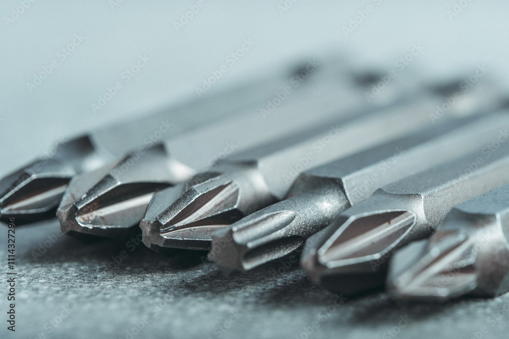 Fototapeta premium Set of bits for tightening screws in closeup. Tool for the master.