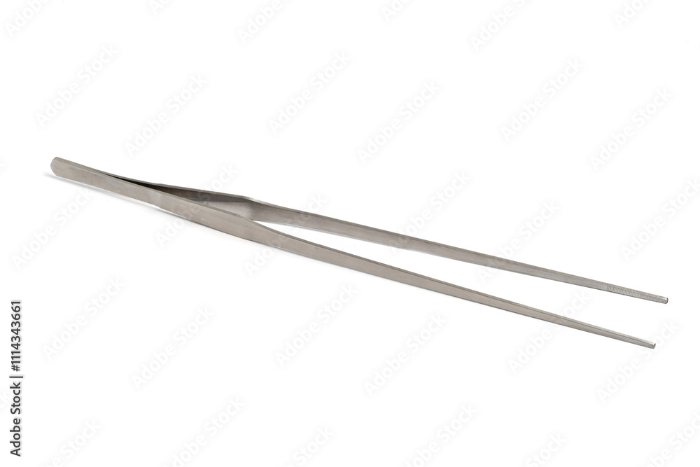Large metal tweezers on a white background, medical equipment. Large metal tweezers on a white background, medical equipment.
