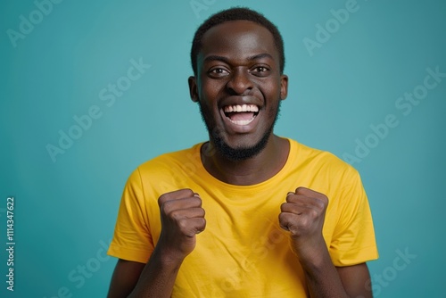 A person wearing a bright yellow shirt lifts their hands in a gesture of defiance or frustration photo