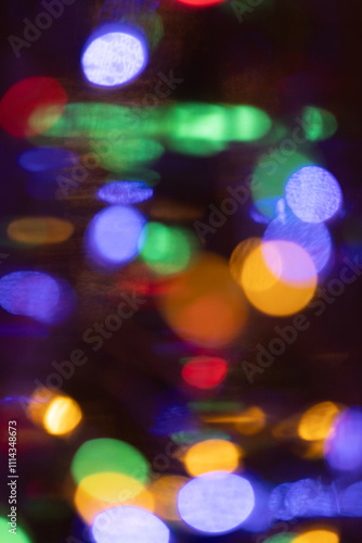 Abstract colored holiday lights background with motion blur