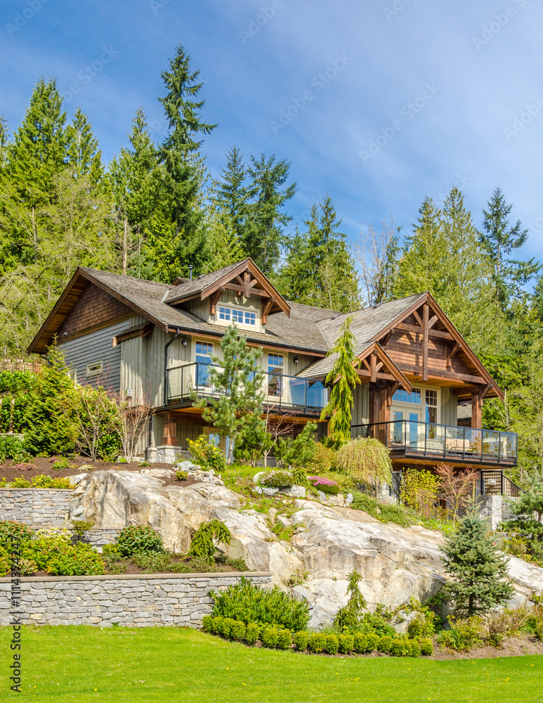 Two story stucco luxury house with nice summer landscape in Vancouver, Canada, North America. Day time on June 2024. Two story stucco luxury house with nice summer landscape in Vancouver, Canada, North America. Day time on June 2024.