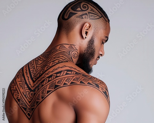 Shoulder tattoo featuring tribalinspired patterns with bold lines and curves photo