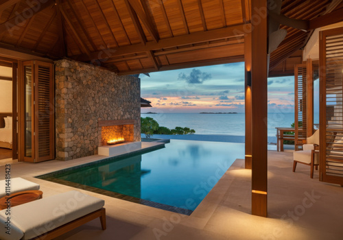 Modern villa with fireplace, infinity pool and ocean view at sunset, offering luxurious and relaxing getaway