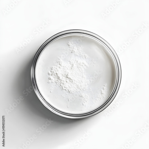 ultrafine white powder in a petri dish, scientific and minimalist look, with small shadow, seen from above, white background photo