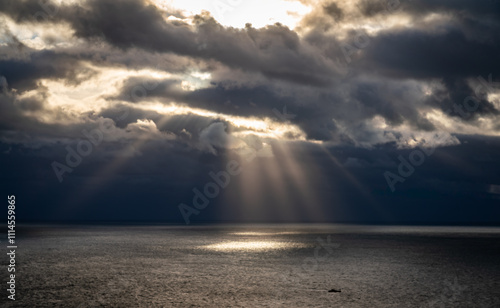 sunbeams over south stack lighthouse Angelsey