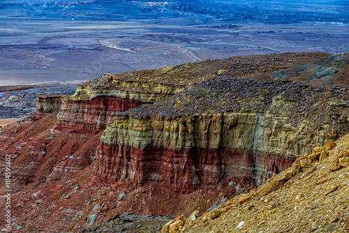 Kazakhstan, Mangistau, Ustyurt National Park, Kokesem. Rainbow Mountains of Kokesem. Geological formation, layered mountains stand out beautifully in red against the plain. photo