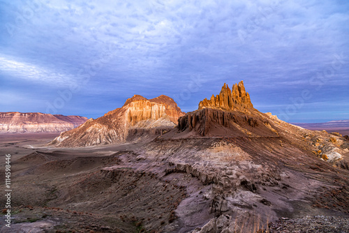 Kazakhstan, Mangistau, Mangyshlak, Airakty. Beautiful jagged mountain with numerous peaks at dawn under a crimson sky. Drone view