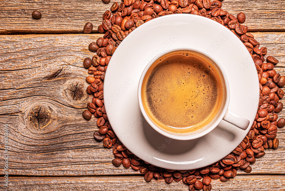 A cup of aromatic coffee on a wooden table.