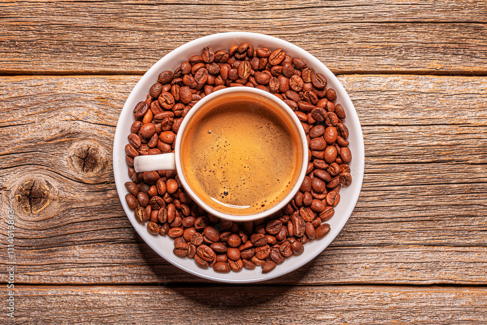 A cup of aromatic coffee on a wooden table.
