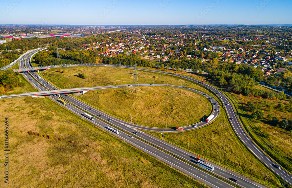 Fototapeta premium Aerial view of beltway route south and east highways Biezanow transportation hub in Kokotow district of Cracow in Poland
