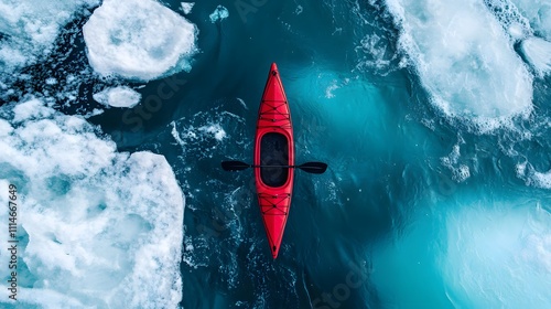 Exploring icy waters in a vibrant red kayak amidst floating icebergs