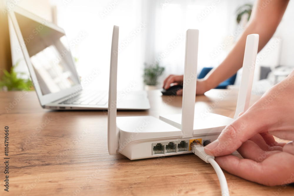Modern wi-fi router on light table in room Modern wi-fi router on light table in room