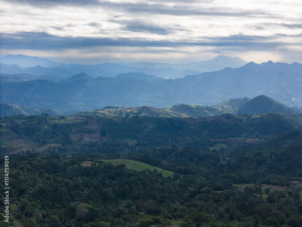 Stunning landscape view of layered mountains and lush forests in early morning Stunning landscape view of layered mountains and lush forests in early morning