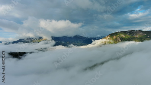 Bild auf Leinwand Aerial view of clouds and mountains at sunrise