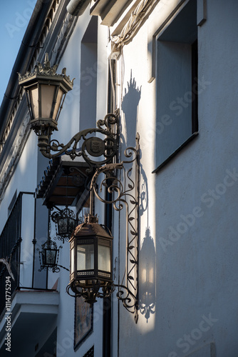 Narrow hilly streets of Ronda, touristic town in Andalusia, Pueblo Blanco white village, Spain.