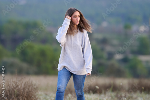 Woman in Casual Outfit Posing in Natural Outdoor Setting photo