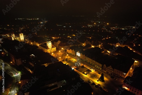 Aerial night panorama of Zatec old town center during Christmas time, illuminated with festive lights and decorations, capturing the magic of this historic Czech town. photo