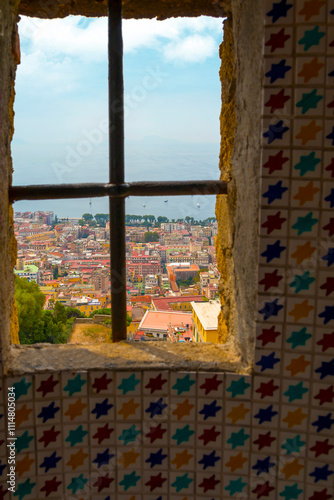Obraz na płótnie Captured from Sant'Elmo Castle, this photo reveals Naples’ vast cityscape, historic architecture, and iconic Mount Vesuvius framed by the Italian sky w salonie