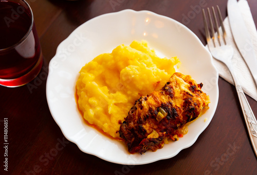 Chicken fillet with mushrooms and mashed potatoes. Modern Russian or Belarusian cuisine photo