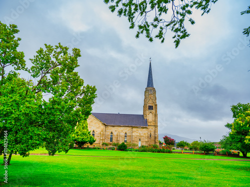 Tree leaves framing N G Kerk church, Wakkerstroom, Mpumalanga, South Africa photo