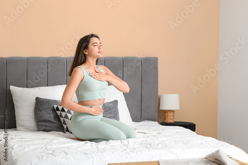 Beautiful young woman doing...