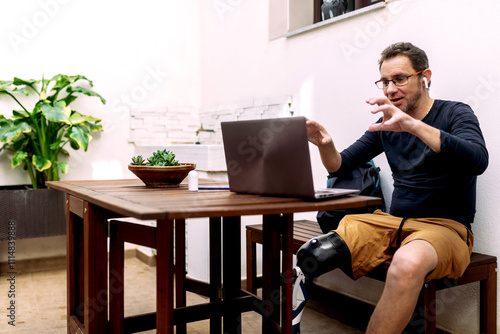 Man with Prosthetic Leg Engaging in a Video Conference Call