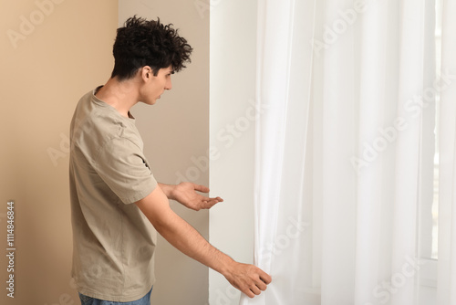Young man with mold on wall...