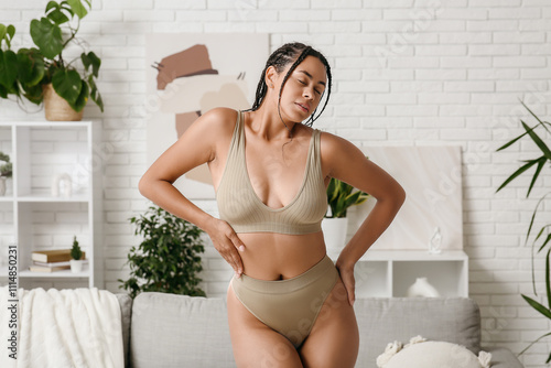 Young woman in underwear wi...