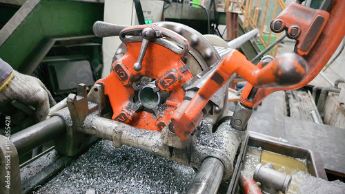 Steel pipe cutting and threading machine for plumbing work in factory, metal technology manufacturing equipment