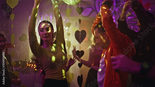 Photos Active people moving dancefloor under disco ball lights