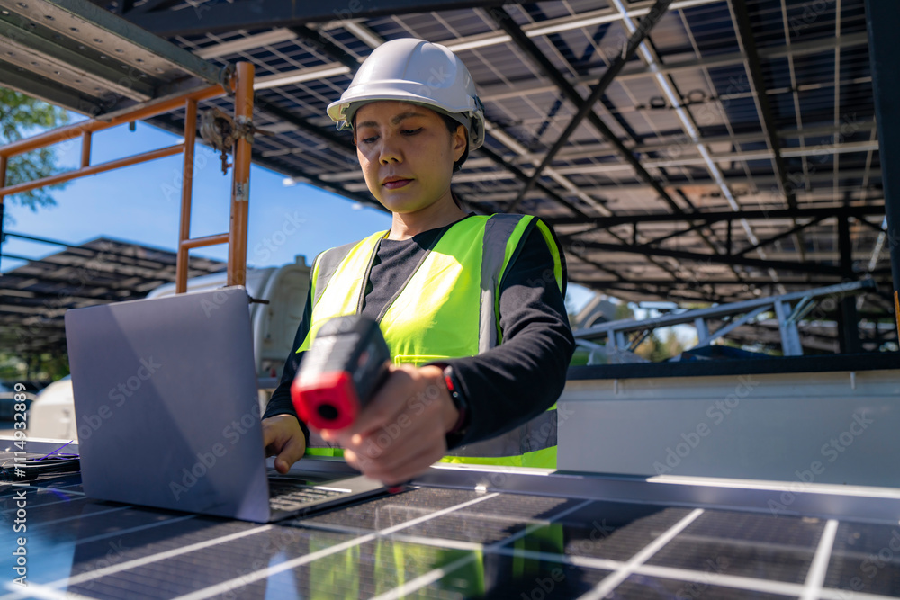 Engineer inspecting solar panels with a laptop, showcasing modern technology and innovation in renewable energy. The panels reflect sunlight, emphasizing their efficiency under a clear blue sky. Engineer inspecting solar panels with a laptop, showcasing modern technology and innovation in renewable energy. The panels reflect sunlight, emphasizing their efficiency under a clear blue sky.