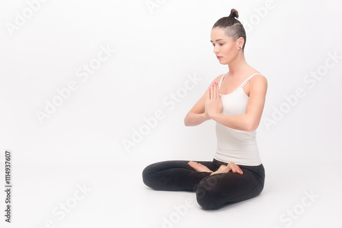 Young woman doing yoga exercise photo