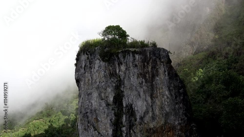 Tropical rocky mountain in colombia with cloud in summer time and sunlight fog