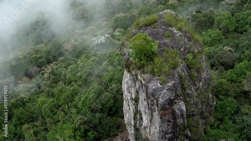 Tropical rocky mountain in colombia with cloud in summer time and sunlight fog