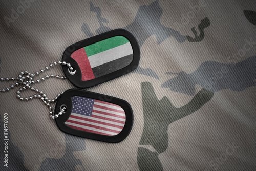 Photography army blank, dog tag with national flag of united arab emirates and united states of america on the khaki texture background