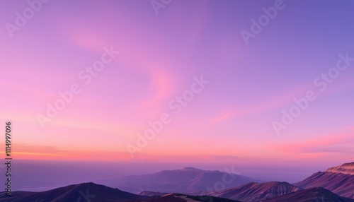 Pink Sunset Over Majestic Mountain Ranges