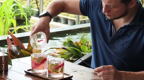 A man is relishing a delightful meal and drinks in a modern cafe  photo