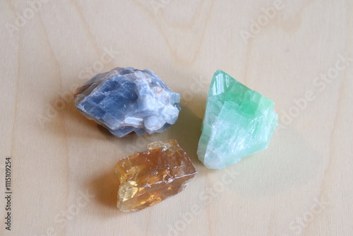 Gemstones and blue, amber or green calcite. A closeup of stones and geologic formation. The benefits of gem and the calcite. Minerals and organics elements. 