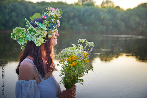 Celebrating Ivan Kupala with traditional fortune telling by the river at sunset photo