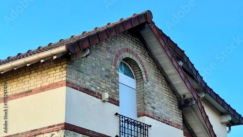 Exterior of a house building taking from perspective low angle over beautiful blue sky with fine weather in Paris, France  photo