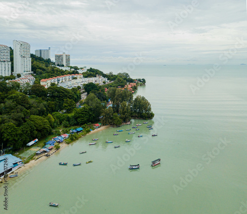 Aerial drone view of cape scenery with fishing boats at Tanjung Bungah, Penang Island, Malaysia  photo