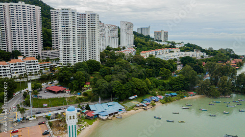 Aerial drone view of residential area with tall apartment buildings at Tanjung Bungah, Penang, Malaysia  photo