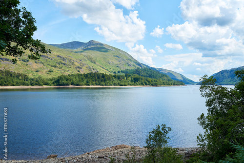 View over Thirlmere reservoir looking towards the 3,118 feet (950 meters) peak of Helvellyn, the 3rd highest peak in the English Lake District photo